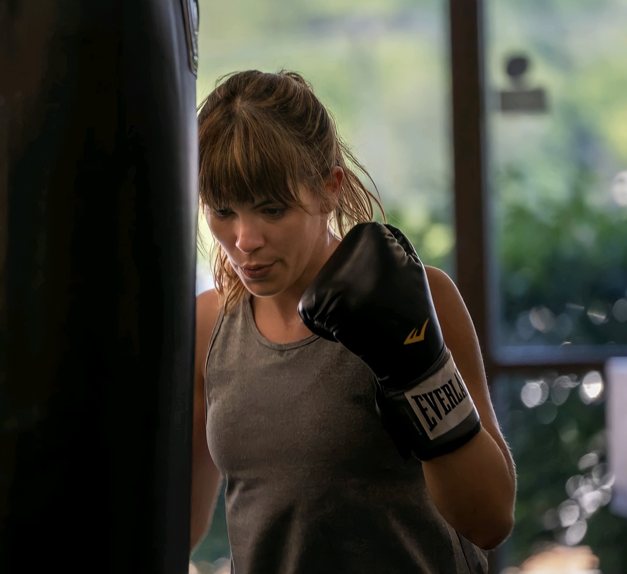 BOX STL member focused during a heavy bag boxing workout
